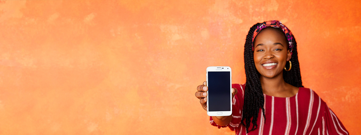 A woman holding a smartphone