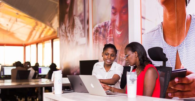 A picture of two women working in an office
