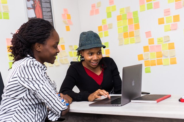 Tala Kenya employees working and talking